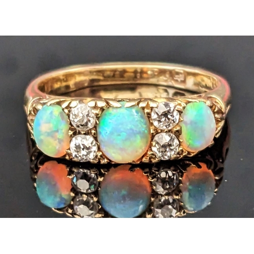 1 - An 18ct Gold, Opal and Diamond Ring, 18mm wide head, hallmarked, size O.25, 4.45g. Marks rubbed, ear...