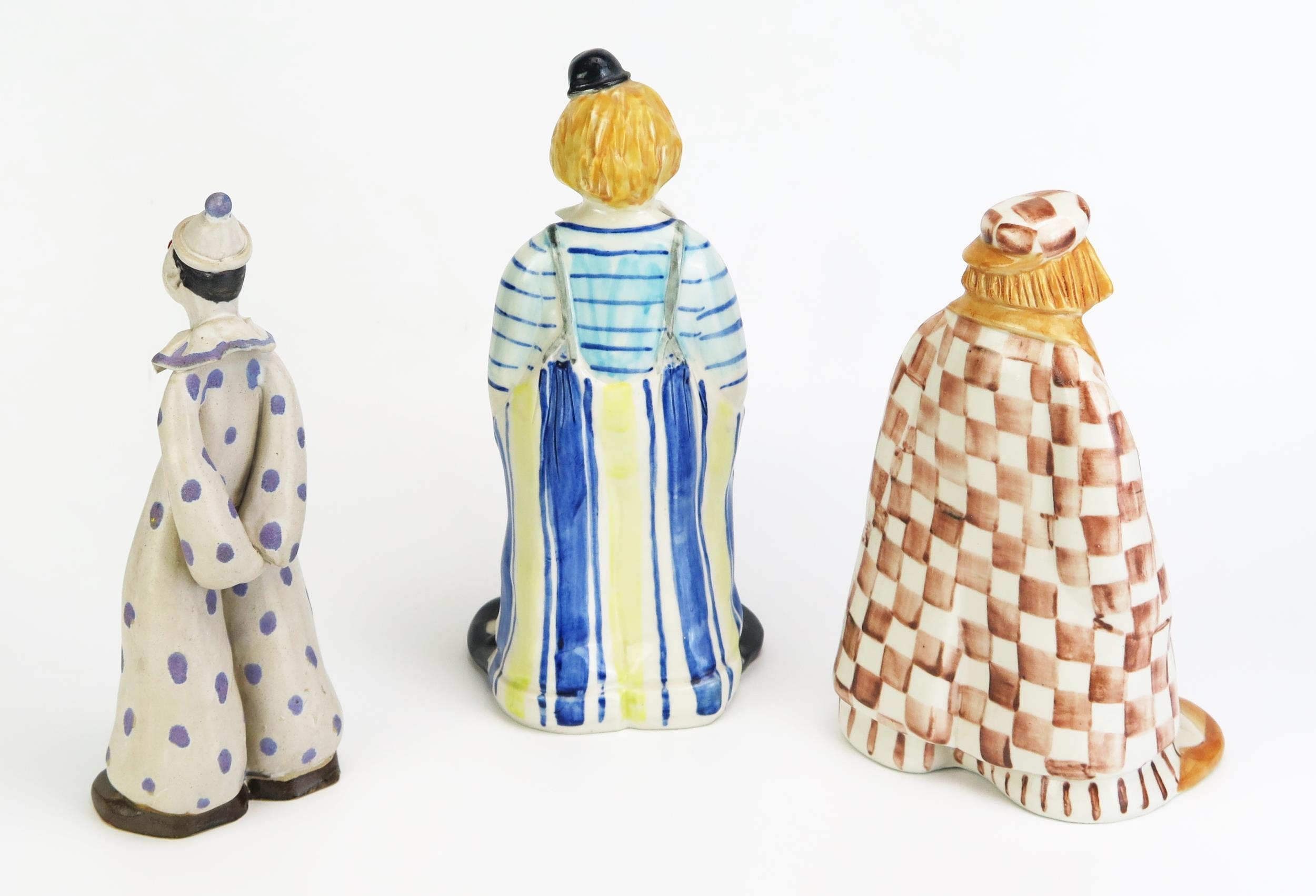 Elizabeth Haslam, three fully glazed models of clowns, in assorted ...