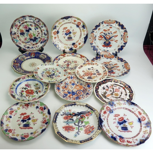 1073 - A collection of Masons and Copeland plates most in the Imari style, including a pair of 1830's perio... 