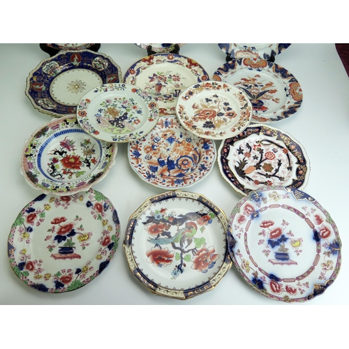 1073 - A collection of Masons and Copeland plates most in the Imari style, including a pair of 1830's perio... 