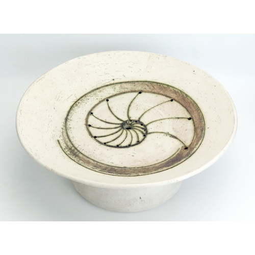 1078 - Laurel Keeley (Contemporary) a stoneware pedestal dish, the centre with incised ammonite and pierced... 