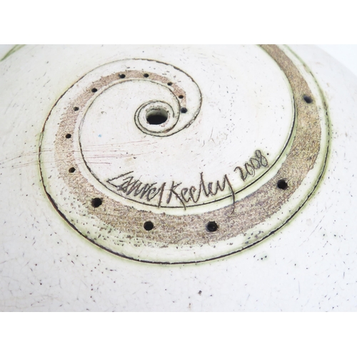 1078 - Laurel Keeley (Contemporary) a stoneware pedestal dish, the centre with incised ammonite and pierced... 