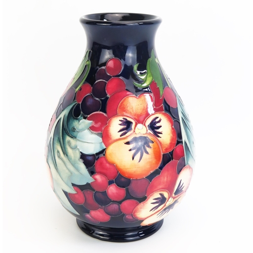 1089 - A Moorcroft 'Fruit Feast' vase, by designer Emma Bossons, released in 2017, numbered edition and sig... 