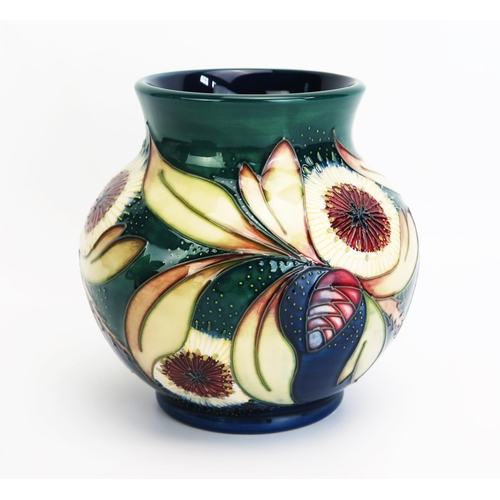 1091 - A Moorcroft pottery vase with 'Albany' pattern decoration by Nicola Slaney, released in 2001, 15cm h... 