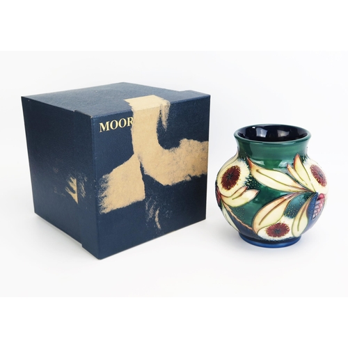 1091 - A Moorcroft pottery vase with 'Albany' pattern decoration by Nicola Slaney, released in 2001, 15cm h... 