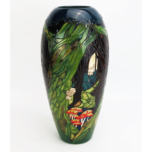 1093 - A Moorcroft pottery vase with 'Ancient Woodland decoration by Paul Hilditch, released in 2019 for RS... 