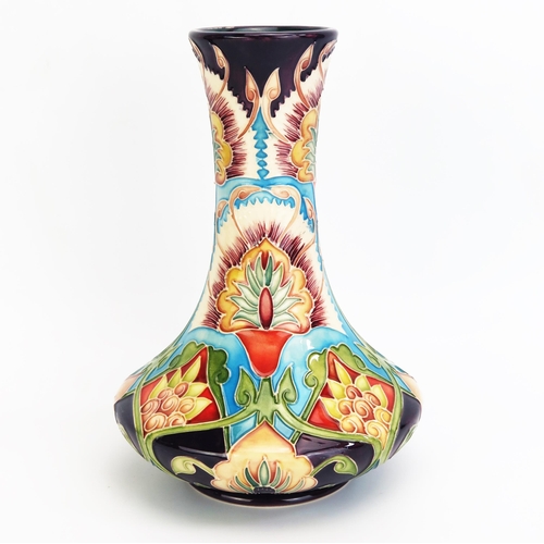 1097 - A Moorcroft pottery vase with 'Bukhara' decoration designed by Shirley Hayes, released in 2002, limi... 