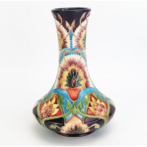 1097 - A Moorcroft pottery vase with 'Bukhara' decoration designed by Shirley Hayes, released in 2002, limi... 