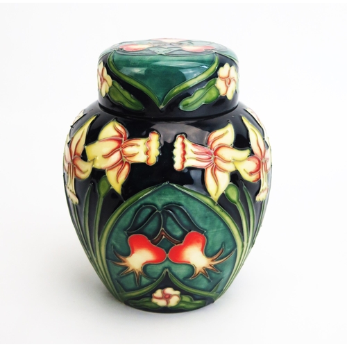 1100 - A Moorcroft pottery ginger jar and cover with 'Carousel' pattern decoration designed by Rachel Bisho... 