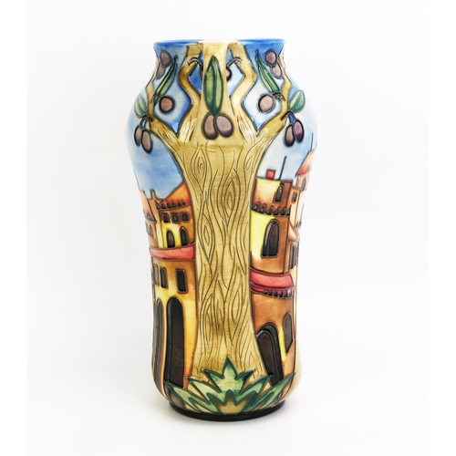 1102 - A Moorcroft pottery twin handled vase with 'Cetona' decoration, designed  by Beverley Wilkes, releas... 