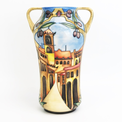 1102 - A Moorcroft pottery twin handled vase with 'Cetona' decoration, designed  by Beverley Wilkes, releas... 