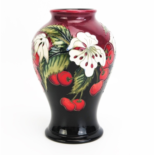 1104 - A Moorcroft pottery vase with 'Cherry Blossom' decoration designed by Nicola Slaney, released in 201... 