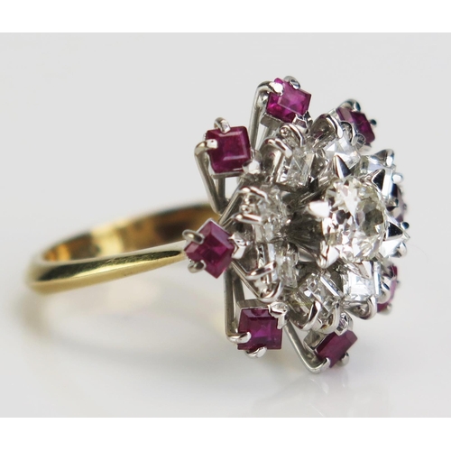 111 - An 18ct Gold, Ruby and Diamond Ring set with a central c. 5mm old cut surrounded by princess cuts, c... 