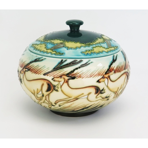 1115 - A Moorcroft pottery pot and cover with 'Impala' decoration designed by Kerry Goodwin, released in 20... 