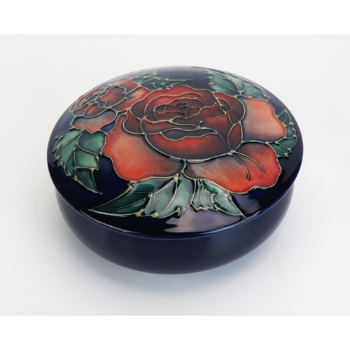 1120 - A Moorcroft pottery pot and cover with 'Rose' pattern decoration, designed by Sally Tuffin, released... 