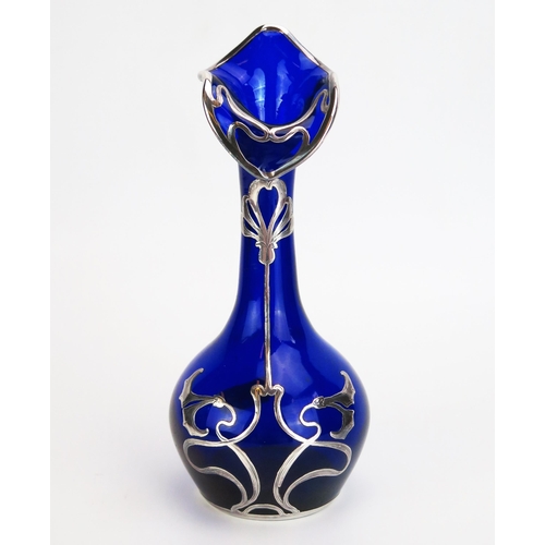 1148 - An Art Nouveau period continental blue glass and silver mounted vase of ovoid form with slender neck... 