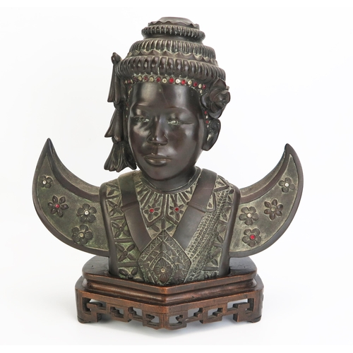 1150 - A 20th century Cambodian bronze bust of a dancer, in traditional costume, with inset paste stones,  ... 