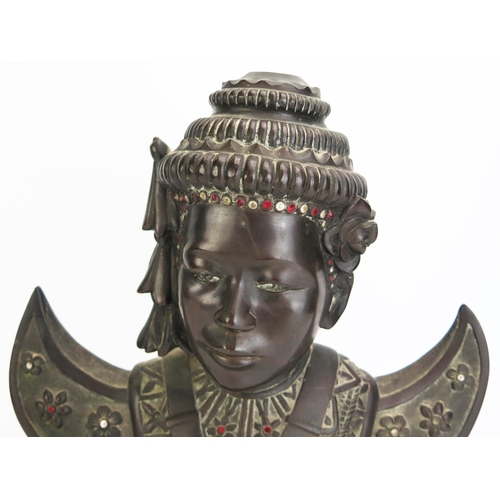 1150 - A 20th century Cambodian bronze bust of a dancer, in traditional costume, with inset paste stones,  ... 