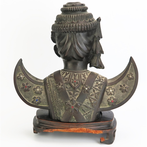 1150 - A 20th century Cambodian bronze bust of a dancer, in traditional costume, with inset paste stones,  ... 