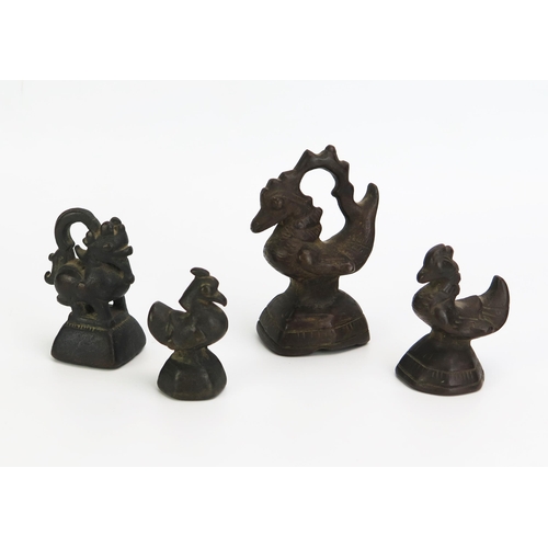 1152 - A part set of four Southeast Asian bronze opium weights in the form of birds, 8cm to 9.5cm high.