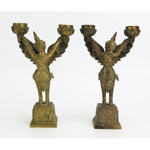 1153 - A pair of Thai cast brass twin branch incense burners in the form of Garuda, in traditional costume,... 