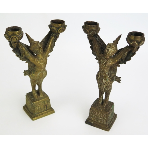 1153 - A pair of Thai cast brass twin branch incense burners in the form of Garuda, in traditional costume,... 