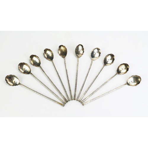 1157 - A set of ten Vietnamese silver cocktail/iced tea sipper spoons, most with stamped marks, having leaf... 