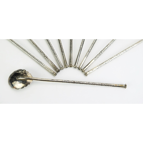 1157 - A set of ten Vietnamese silver cocktail/iced tea sipper spoons, most with stamped marks, having leaf... 