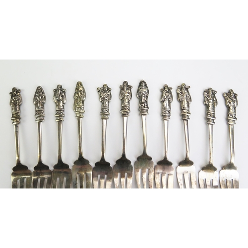 1159 - A set of eleven Chinese silver pastry forks, with figural terminals together with a Vietnamese silve... 