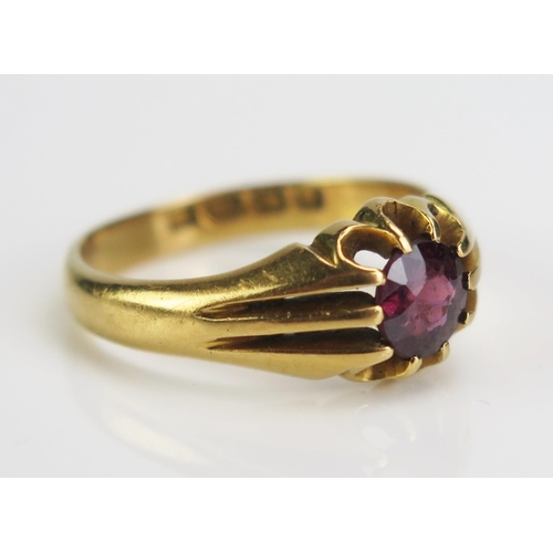 116 - An 18ct Gold and Red Stone Solitaire Ring, c. 6mm stone, size P.5, Birmingham 1915, c.5.85g