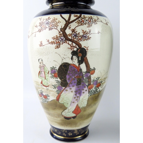 1171 - A large pair of Japanese vases of ovoid form, decorated with panels depicting figures in garden land... 