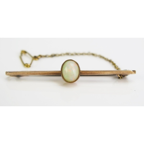 118 - An Opal Brooch with safety chain in an unmarked precious yellow metal setting, KEE tested as 9ct+, 8... 