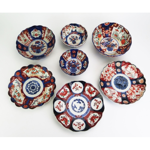 1180 - Four assorted Imari porcelain bowls of lobed form, 18cm and 13.5cm diameter, together with three pla... 