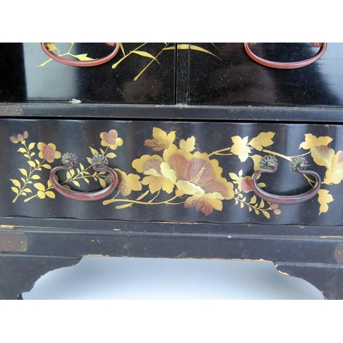 1183 - A Japanese lacquered ware kodansu of arched outline, decorated all over with birds amongst foliage, ... 