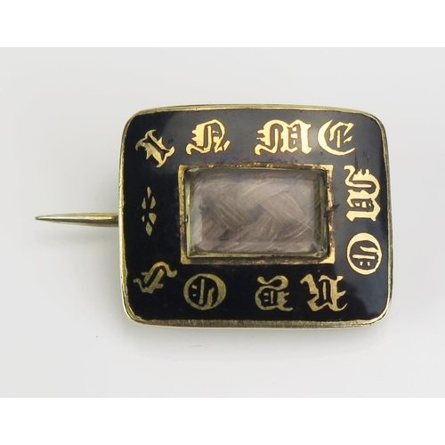 119 - A William IV Black Enamel Memorial Brooch in an unmarked yellow metal setting with platted hair to t... 