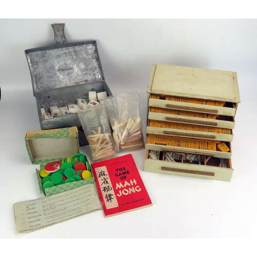 1190 - A Mahjong set contained in a fitted case, together with another Mahjong set. (2).