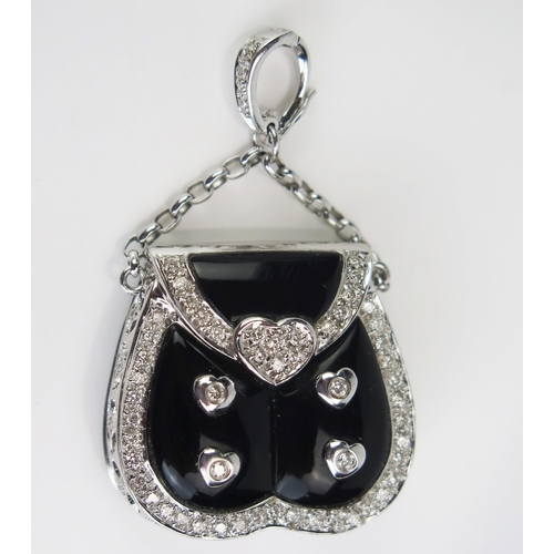 124 - An 18ct White Gold, Diamond and Black Enamel Pendant in the form of a handbag with hinged cover open... 