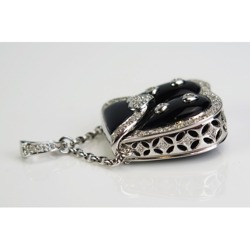 124 - An 18ct White Gold, Diamond and Black Enamel Pendant in the form of a handbag with hinged cover open... 