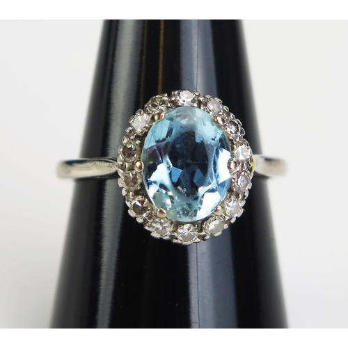 125 - An 18ct White Gold and Platinum, Aqua Marine and Diamond Cluster Ring, 14x13mm head, size R.5, c. 4.... 