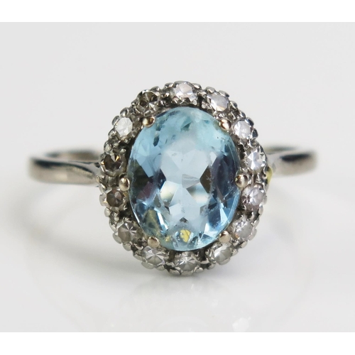 125 - An 18ct White Gold and Platinum, Aqua Marine and Diamond Cluster Ring, 14x13mm head, size R.5, c. 4.... 