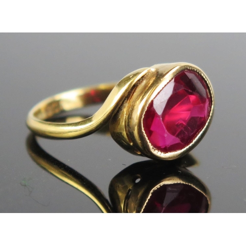 138 - An 18ct Gold and Red Sapphire? Ring, c. 10x8mm stone, size O, c. 3.98g