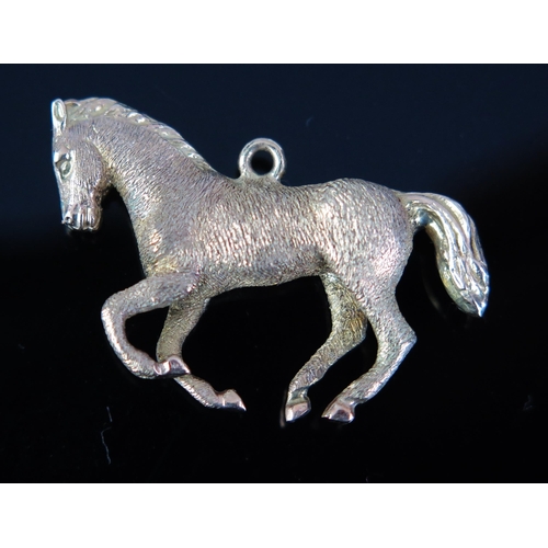 149 - A 9ct Gold Galloping Horse Charm, c. 5.27g