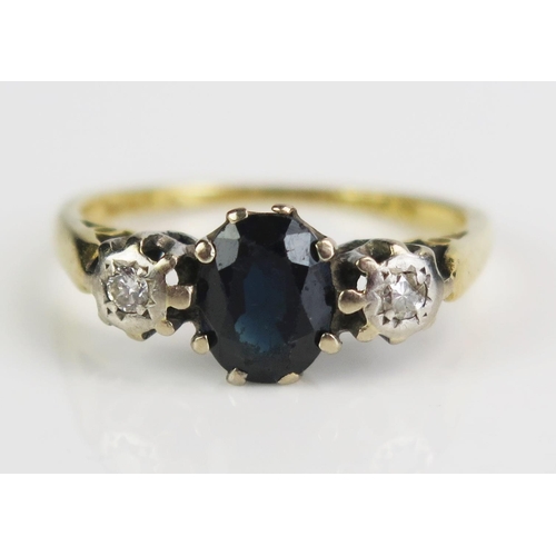 151 - An 18ct Gold, Sapphire and Diamond Three Stone Ring, c. 7.5x5.5mm principal stone, size K.5, 2.94g