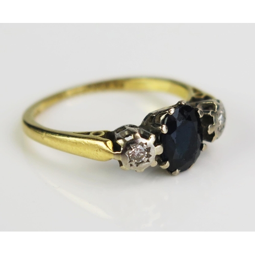 151 - An 18ct Gold, Sapphire and Diamond Three Stone Ring, c. 7.5x5.5mm principal stone, size K.5, 2.94g