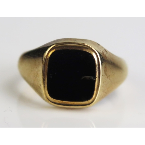 168 - A 9ct Gold and Black Onyx Signet Ring, hallmarked, size S.25, c. 7.78g