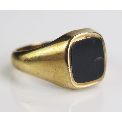 168 - A 9ct Gold and Black Onyx Signet Ring, hallmarked, size S.25, c. 7.78g