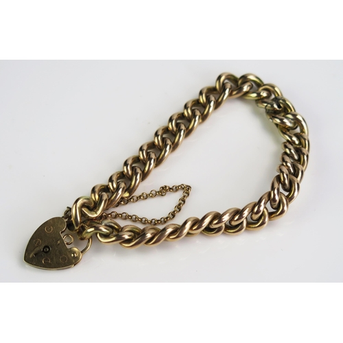 172 - A 10ct Gold Curb Link Bracelet with 9ct gold 'padlock' clasp and safety chain, c. 21.59g