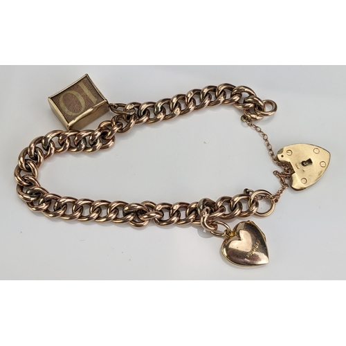 21 - A 9ct Gold Curb Link Bracelet with 10 shilling note charm, heart shaped locket charm and damaged 'pa... 