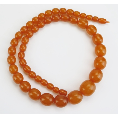 242 - A Faux Amber Bead Necklace, 25.5