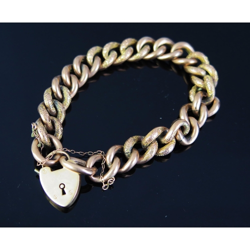 267 - An Antique 9ct Gold Curb Link Bracelet with 'padlock' clasp and decorated links, c. 21.75g